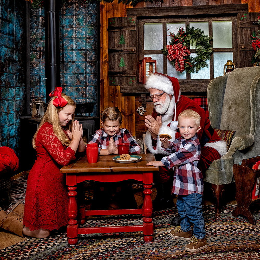 Children with Santa saying Prayers